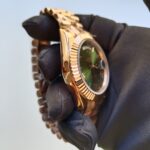 rolex-day-date-40mm-president-rose-gold-fluted-bezel-green-roman-dial-mens-watch-replica-syqgc.webp
