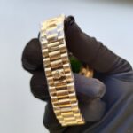 rolex-day-date-40mm-yellow-gold-silver-roman-dial-fluted-bezel-president-bracelet-228238-replica-tjvny.webp