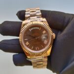 rolex-day-date-41mm-president-rose-gold-fluted-bezel-chocolate-roman-dial-mens-watch-228235-replica-s5uhv.webp