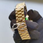 rolex-day-date-ii-yellow-gold-champagne-diamond-41mm-roman-dial-diamond-bezel-president-bracelet-watch-replica-1d6yp.webp