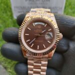 rolex-everose-gold-day-date-40-watch-fluted-bezel-chocolate-diagonal-motif-index-dial-president-bracelet-replica-gizjn.jpg
