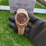 rolex-everose-gold-day-date-40-watch-fluted-bezel-chocolate-diagonal-motif-index-dial-president-bracelet-replica-gizjn.jpg